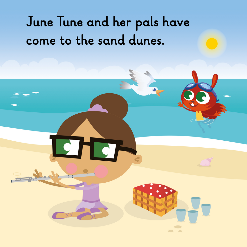 Learn phonics with Actiphons June Tune reading book page 1 June Tune is playing a tune on her flute at the beach next to her picnic basket when Swimming Sally swims by