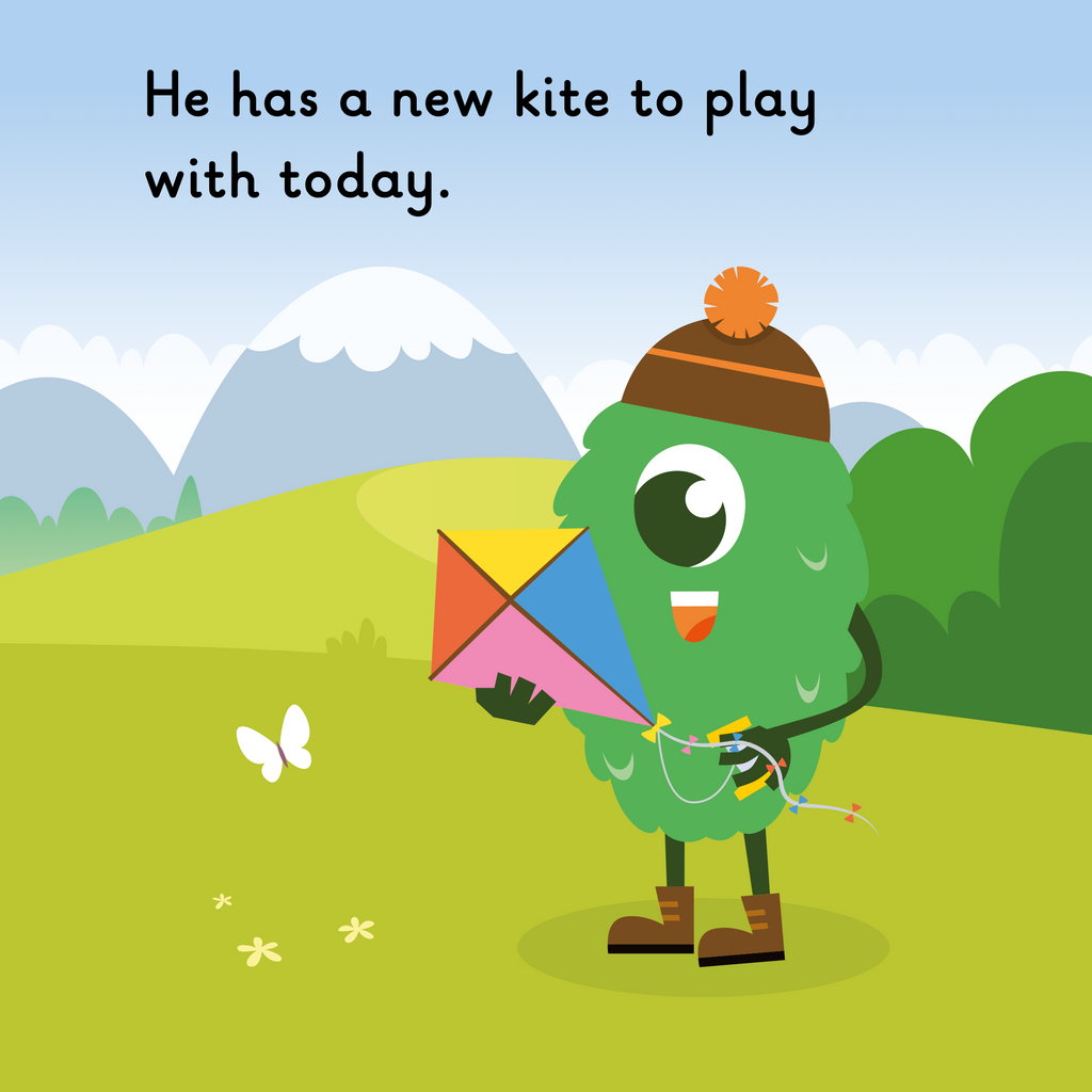 Learn phonics with Actiphons Kite Mike reading book page 2 Kite Mike  is wearing his favourite brown wooly bob hat looking at his new courlful kite 